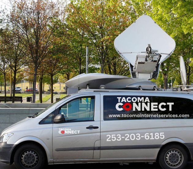 Tacoma Connect van offering internet and TV services, stationed in a Tacoma neighborhood, showcasing local connectivity.